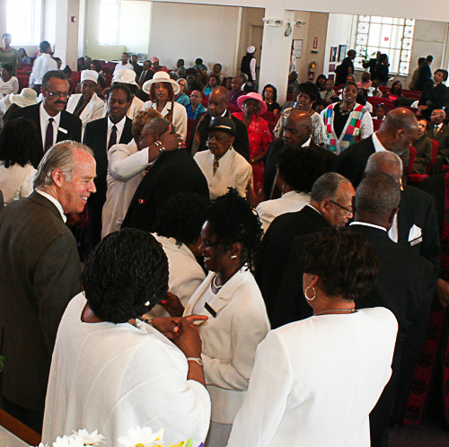 Ministers and Deacons greeting the congregation