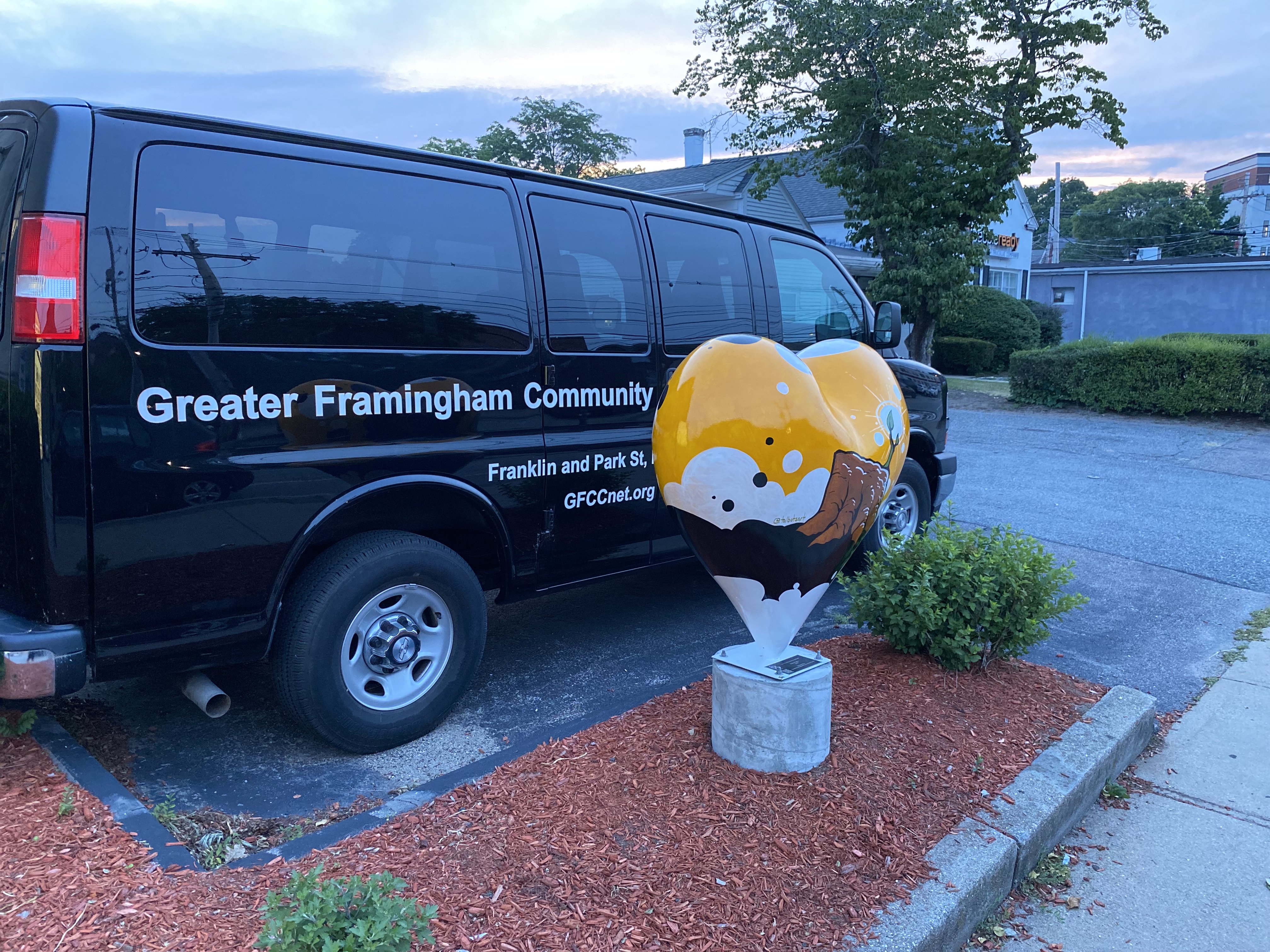 Hearts Around Framingham sculpture in front of the church van